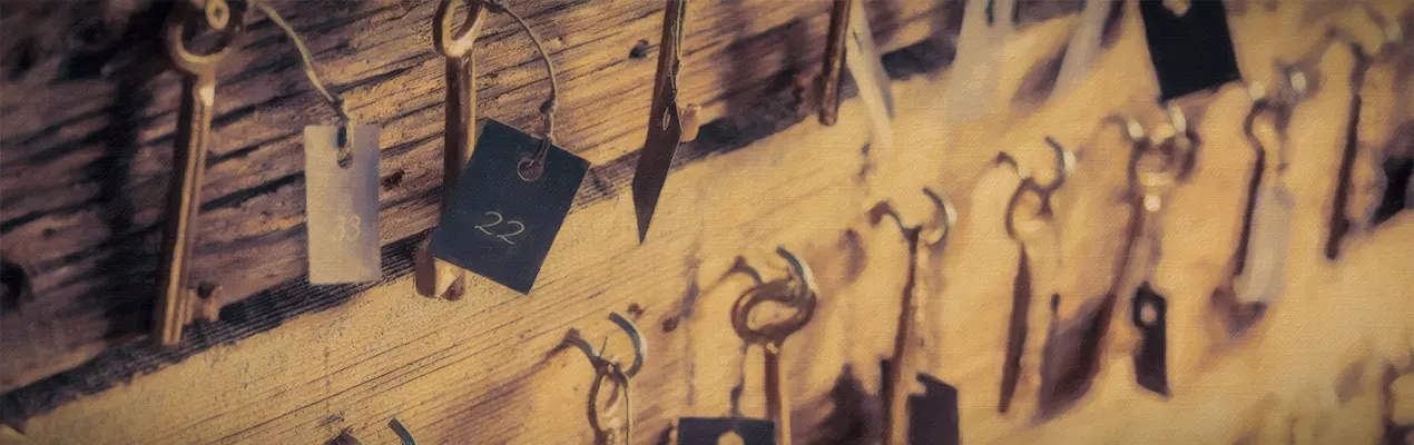 Door keys on the wooden wall