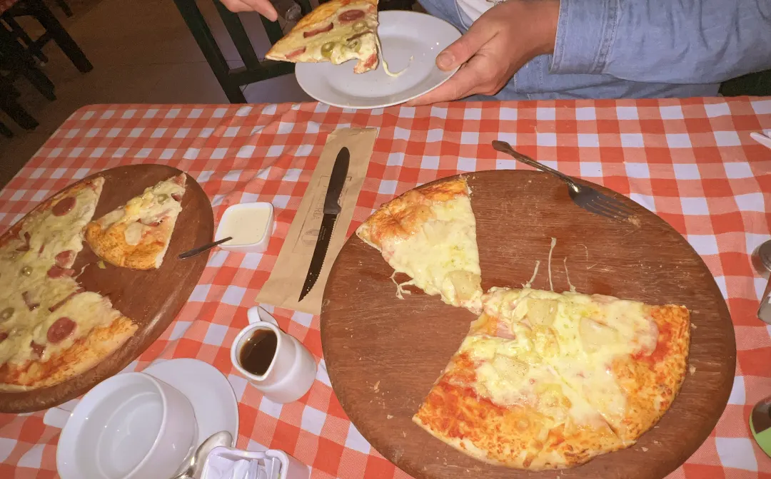 table with pizzas